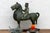 This striking pottery sculpture, depicting a noble figure astride a powerful steed, embodies the grandeur and dynamism of...