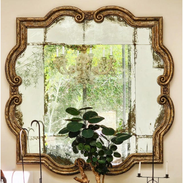 A beautiful mirror by Formations. Hand painted and hand carved, antique mirror finish. The Quatrefoil mirror.