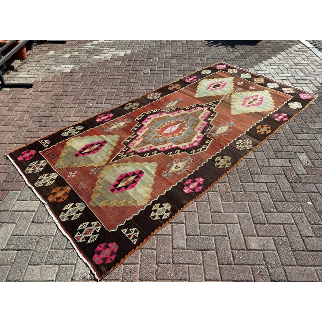 This beautiful, vintage, handwoven kilim is approximately 60 years old. It is handmade of very fine quality wool and...