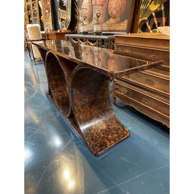The Karl Springer Design Brown Parchment Console Table is a stylish and elegant piece of furniture perfect for any modern...