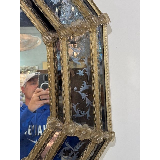 The vintage etched Murano Glass Venetian Style octagonal mirror is a stunning piece that exudes elegance and charm. With...