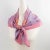 This lovely silk scarf by Christian Dior Paris features a geometric design print in pink and orange colors. The Christian...