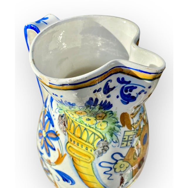 This is an antique Italian ceramic jug, likely from the Montelupo Fiorentino factory, dating to around the late 19th...