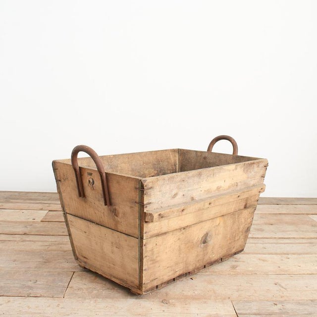 A grape collection crate from a French vineyard in the Champagne region of France. The crates are solid wood with metal...