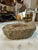 A substantial marble ashtray featuring rich brown, taupe, and cream natural veining. Its irregular, organic shape and...