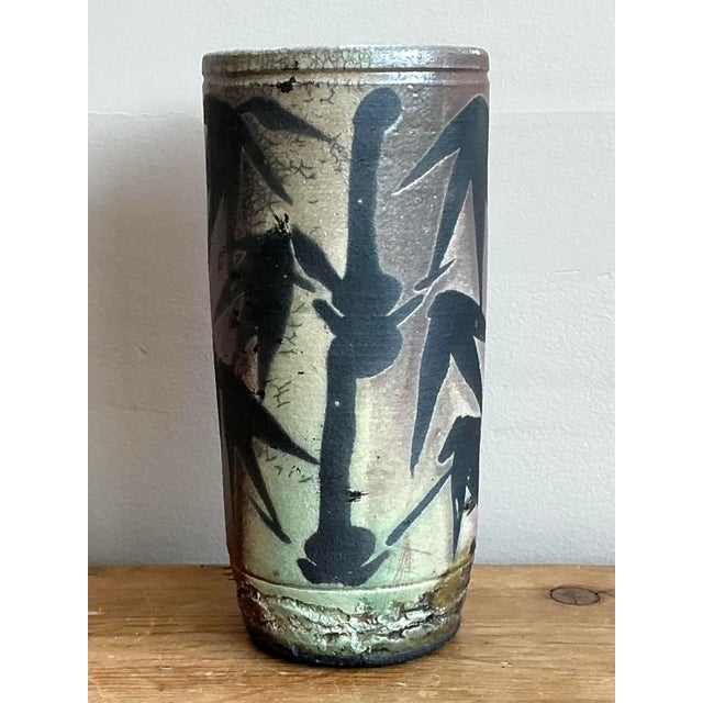 This sophisticated vintage studio pottery vase showcases a masterful blend of organic texture and Eastern-inspired...