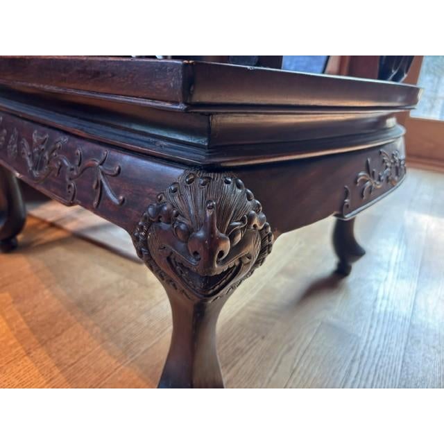 Pair of antique Chinese horseshoe armchairs crafted from a heavy, dense exotic hardwood, most likely rosewood (Hongmu)....