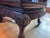 Pair of antique Chinese horseshoe armchairs crafted from a heavy, dense exotic hardwood, most likely rosewood (Hongmu)....