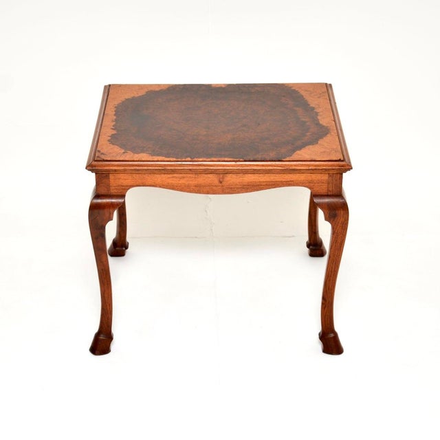 A gorgeous antique burr walnut coffee table, made in England and dating from around the 1920’s. It is a lovely petite...