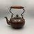 This exquisite piece features a classic bulbous body made of copper with a rich, aged patina finish. The surface is...