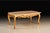 Coffee table richly adorned with a hand-applied 24-karat gold leaf finish that highlights every curve and carving. The...
