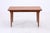 The classic Model 54 dining table by Omann Jun features a beautiful teak grain and the characteristic curved details on...