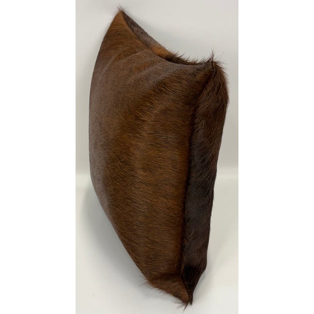 Rich, dramatic, and unmistakably natural, this 16” x 16” pillow cover is crafted from premium Brazilian Watusi cowhide in...