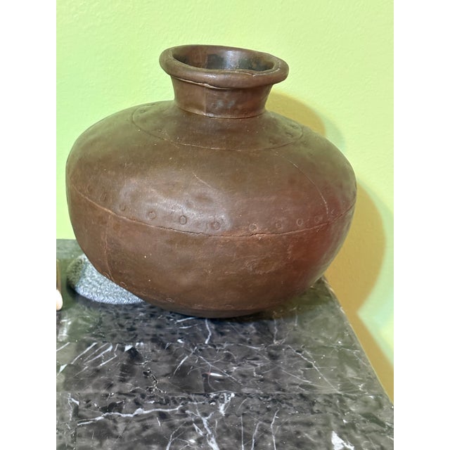 Antique Indian ghada bronze water vessel with a deep, time‑worn patina and a sculptural presence that speaks to centuries...