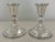 Matching weighted sterling silver pair of Edwardian candlestick holders, with fluted baluster column on a circular base....