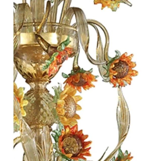 Venetian floreal chandelier made in amber and green murano glass with sunflowers in yellow and orange paste. Full of...
