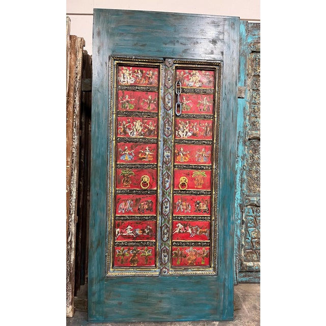 A striking statement piece for any entryway, courtyard, or interior passage — this hand-carved wooden barn door features...