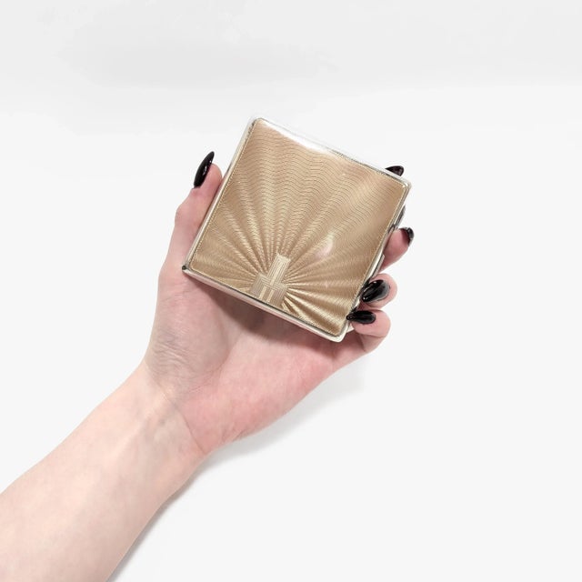 A fine vintage English silver & enamel cigarette case. In sterling silver. By the Goldsmiths & Silversmiths Co. Ltd. of...