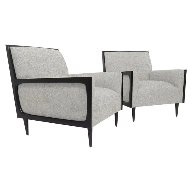Modern mid century style lounge chairs. The set of chairs are newly upholstered and refinished. The chairs are done in a...