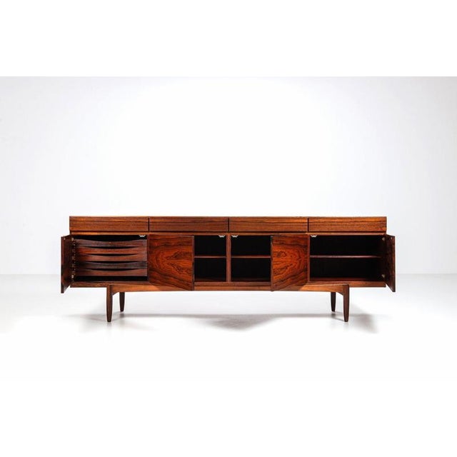 Exceptional “FA-66” sideboard designed by Ib Kofod-Larsen and produced by Faarup Møbelfabrik in Denmark, circa 1960....