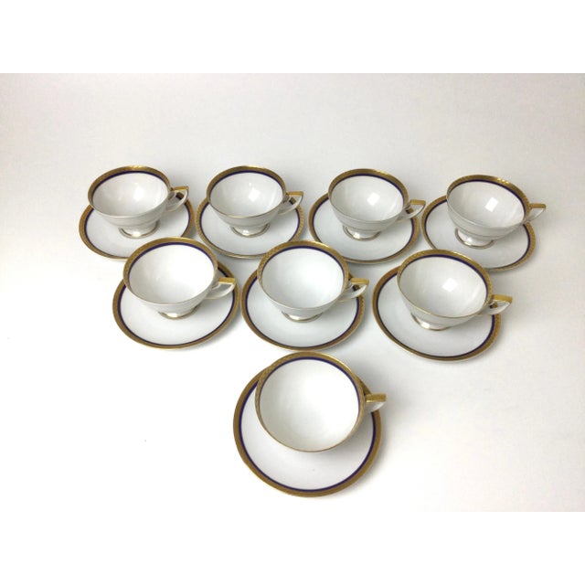 Set of 8 Royal Bayreuth China cups & saucers white with cobalt and gilt borders. Wonderful condition, with no wear to the...