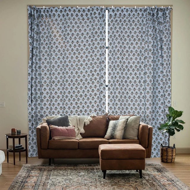 Elevate your home décor with this viscose colored linen block print ring curtain. Soft and breathable, it drapes...