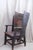 The Orkney chair has an oak frame supporting a back in the style of handwoven straw wingback. The wooden base with...