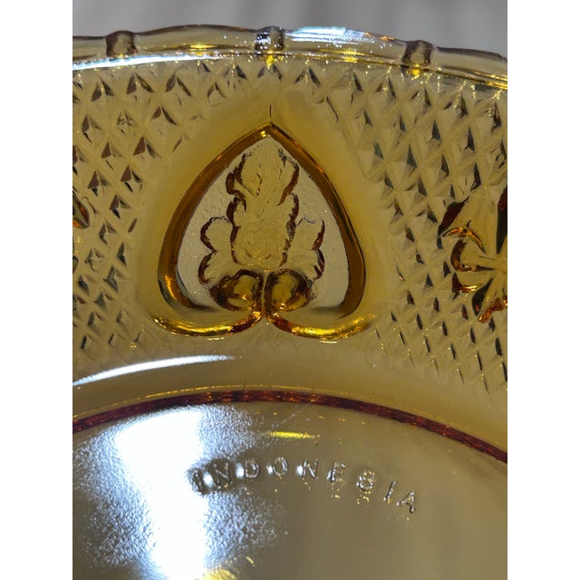 Vintage KIG Indonesia Amber Pressed Glass Dinner Plate this plate offers timeless appeal with its rich golden amber color...
