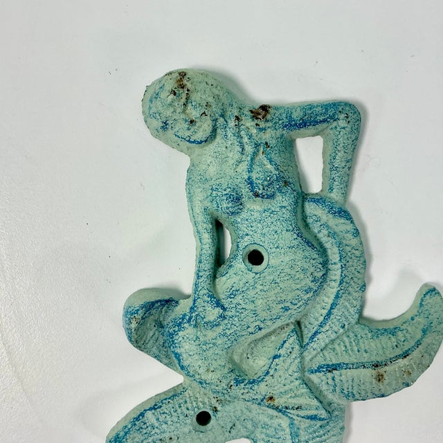 We couldn’t pick this fabulous Wall Hook up fast enough when we saw it. The cast iron item is a Mermaid sitting on a...