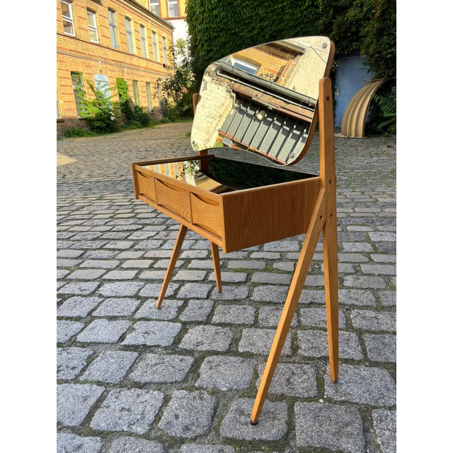 This dressing table is truly unique. The curved drawers are typical of designer Arne Vodder. Most Danish furniture was...