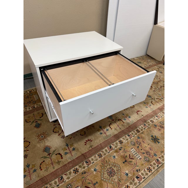 Design Plus Gallery presents the Two-Drawer File Cabinet from Room & Board. This white cabinet has a streamlined form with...