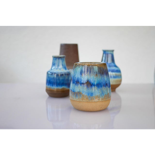 A refined collection of four vintage ceramic vases by Michael Andersen & Son, Bornholm, Denmark. Executed in heavy...