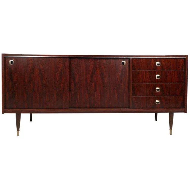 This stunning mid-century modern sideboard offers plenty of room for storage within its four hefty drawers and large...