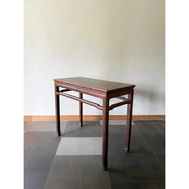This elegant console table was crafted in Northern China at the beginning of the 20th century. Crafted from Ironwood this...