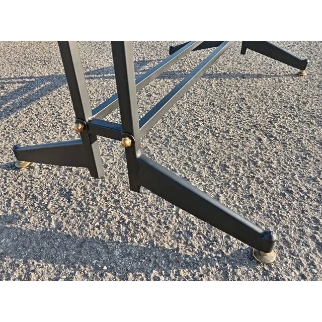 1960s coffee table, honey onyx top, iron foot with brass feet.