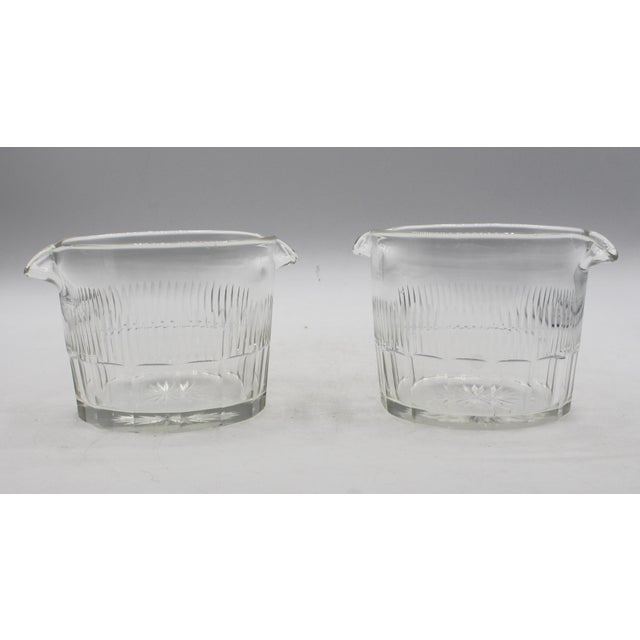 Circa 1790-1810 Anglo-Irish pair of glass wine rinsers. George III period. Featuring a combination of panel cut bases...