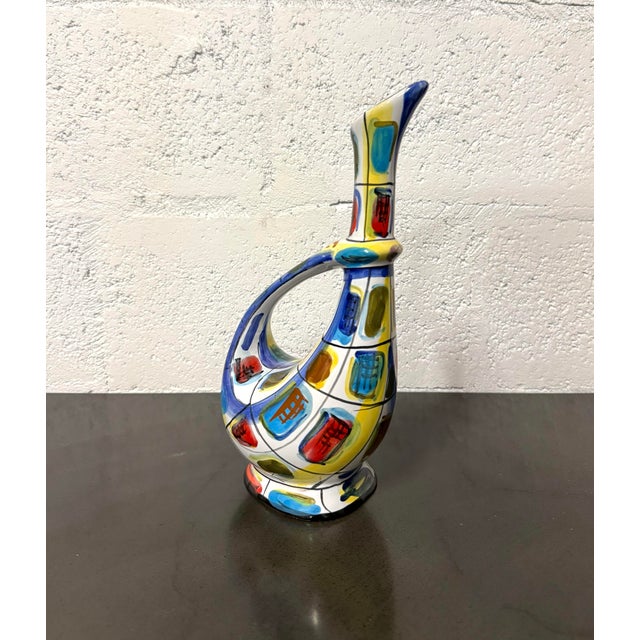Vintage Italian ceramic decanter featuring a sculptural teardrop body, elongated neck, angled spout, and sweeping...