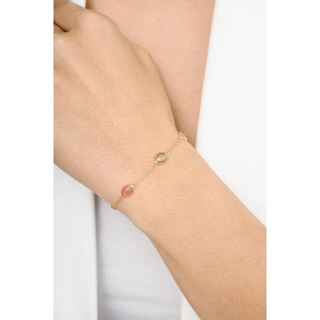This is part of Chairish’s Fine Jewelry assortment. This Handcrafted Multi Tourmaline Station Chain Bracelet in 18K gold...