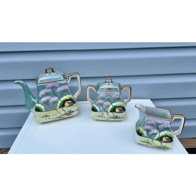 Early 20th Century Hand Painted Moriyama Japanese Tea Set. Vintage Japanese Relief & lusterware set. These pieces feature...