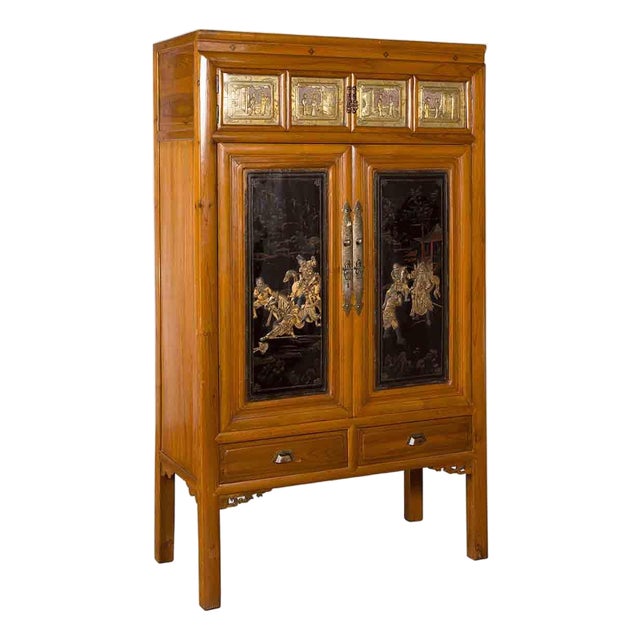 Chinese Early 20th Century Lacquered Armoire With Gilt Carved Warrior Motifs For Sale