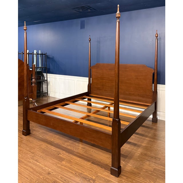 This is a traditional mahogany king size Pencil Post bed by Leighton Hall. It features classic clean lines with round...