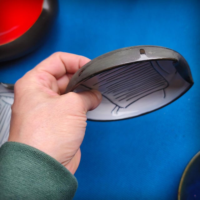 Jacques Innocenti, pair of bowls decorated with stylized animals. The ceramics are partially covered in black slip and...