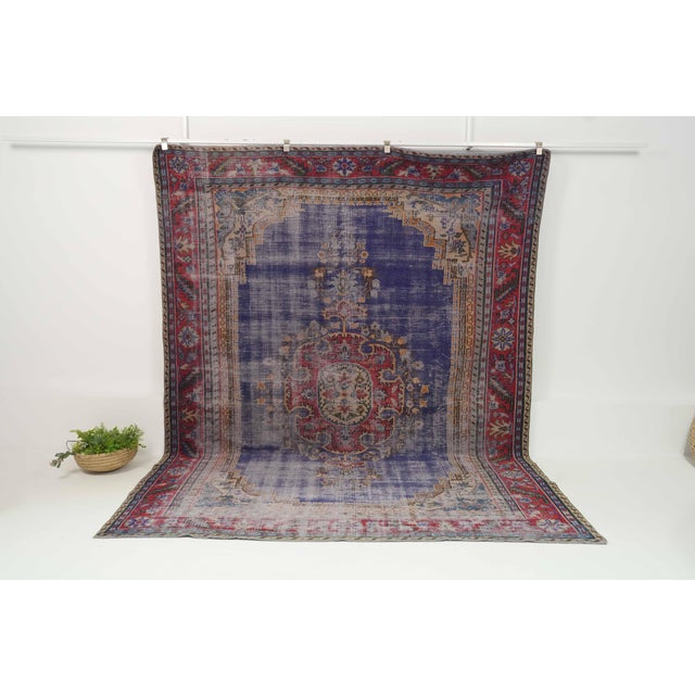Vintage Hand-Knotted runner rug is a semi-antique vintage area rug. The '70s Eastern region of Anatolia's unique rug is...