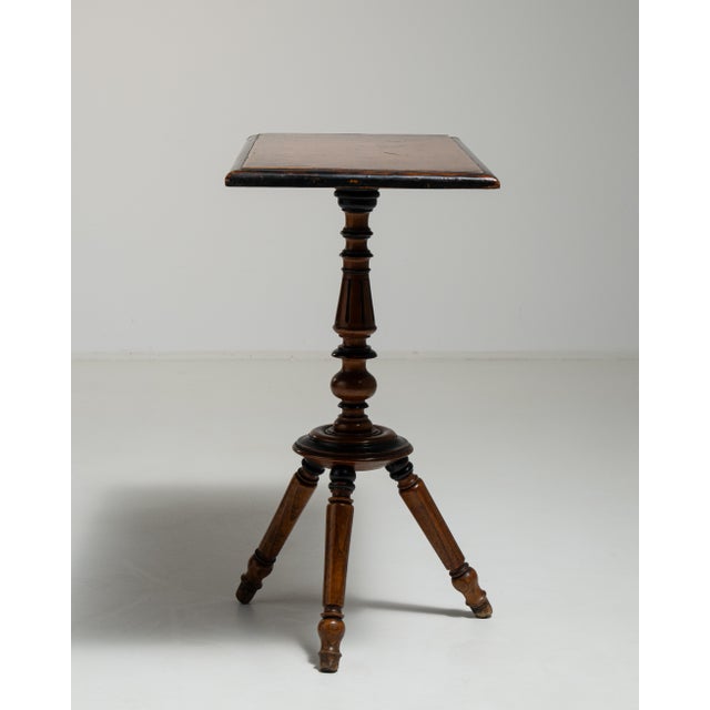 A distinguished example of 19th-century French craftsmanship, this eclectic side table reflects the period's...