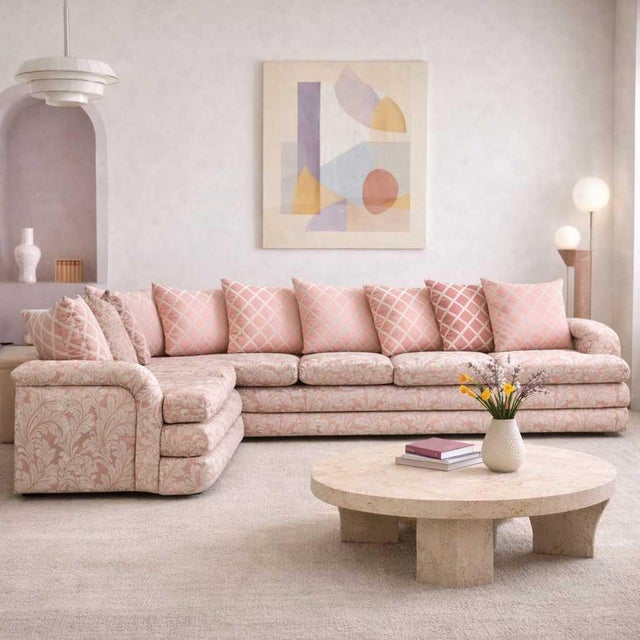 1980s Postmodern Pink Floral Curved Sectional Sofa. A substantial vintage two-piece sectional with a curved L-shaped...