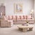 1980s Postmodern Pink Floral Curved Sectional Sofa. A substantial vintage two-piece sectional with a curved L-shaped...