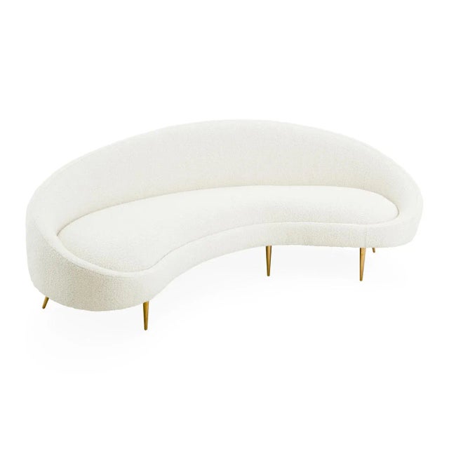 Heaven Sent. A curved sofa announces to the world that you are on the varsity decorating squad. Airy yet edgy, our Ether...