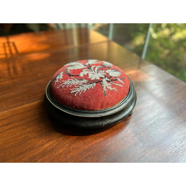 A small Victorian beaded needlepoint footstool,