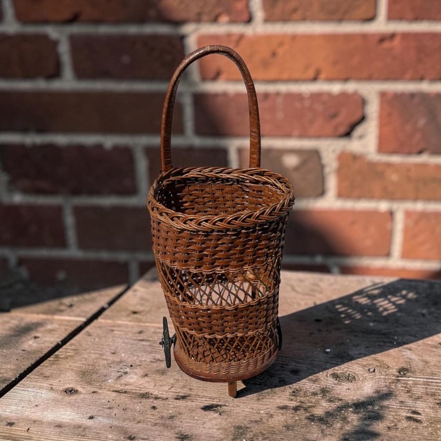 Rustic European Early 20th Century Handwoven Wicker Rolling Market Basket With Iron Wheels For Sale - Image 3 of 9
