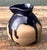 Elevate your tabletop or shelving display with this exquisite original studio pottery pitcher, a testament to the organic...